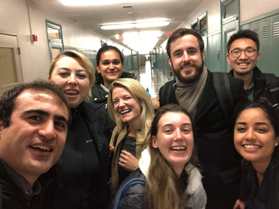 Henry Pan with classmates in BU's CAS building.