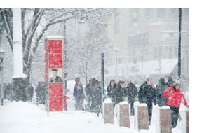 s13prepare1 Students walking on the Commonwealth Ave sidewalk at Marsh Plaza. Photograph by Vernon Doucette