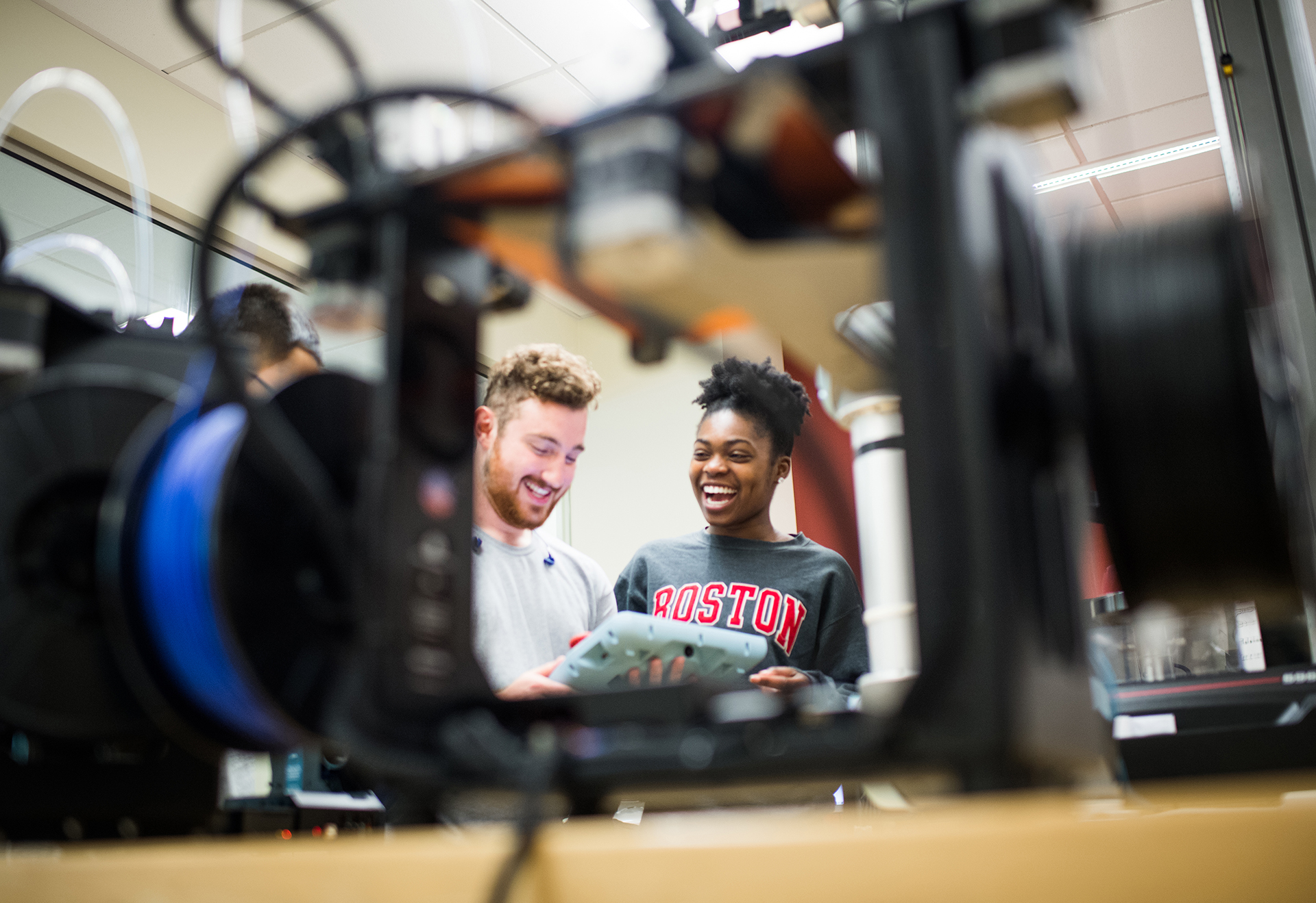 Wyatt Perry (ENG 19) and Chika Okoye (ENG 19) work on a design for a metamaterial auto crusher at EPIC.