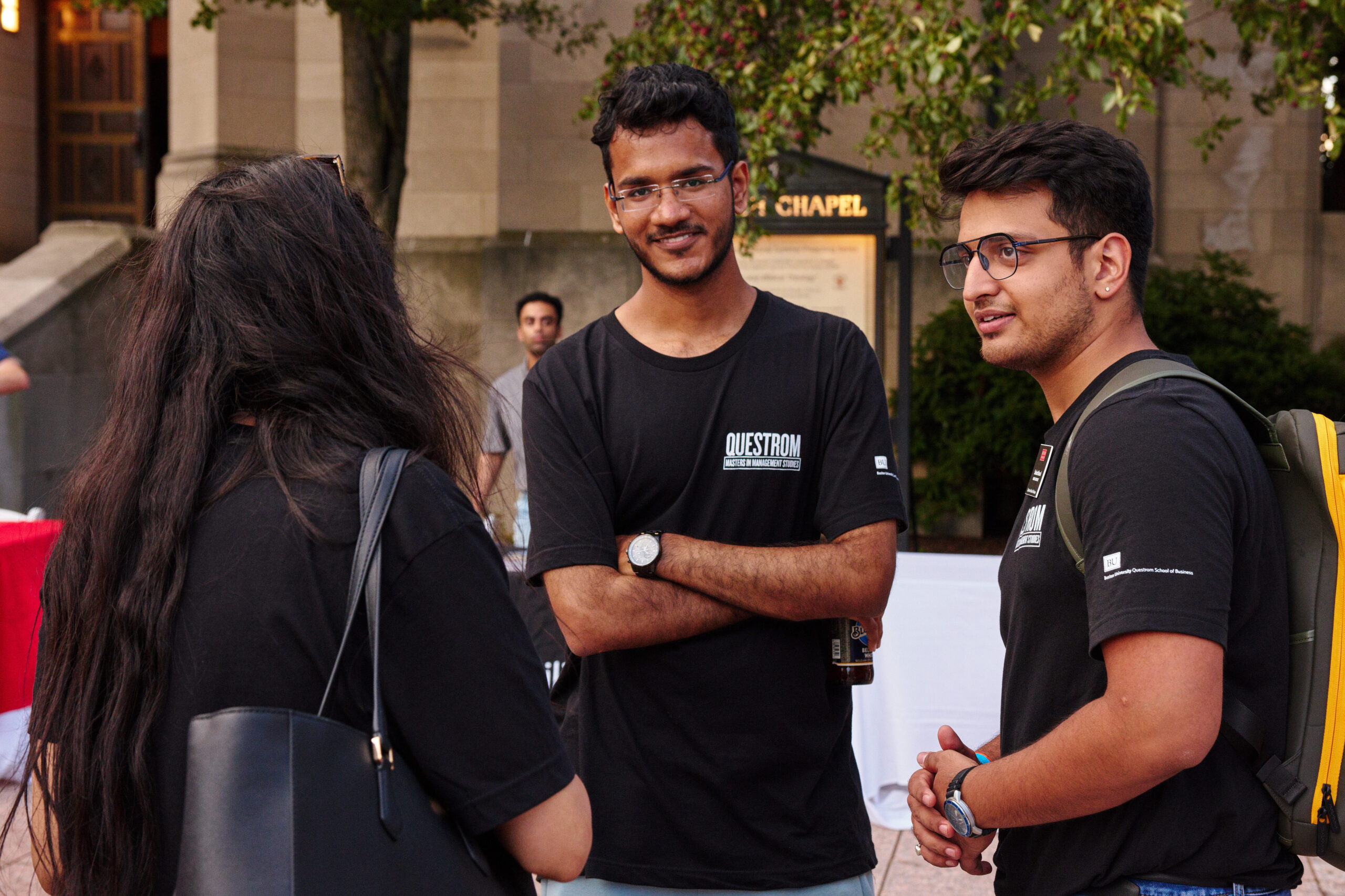 Students with backpacks a conversation on campus