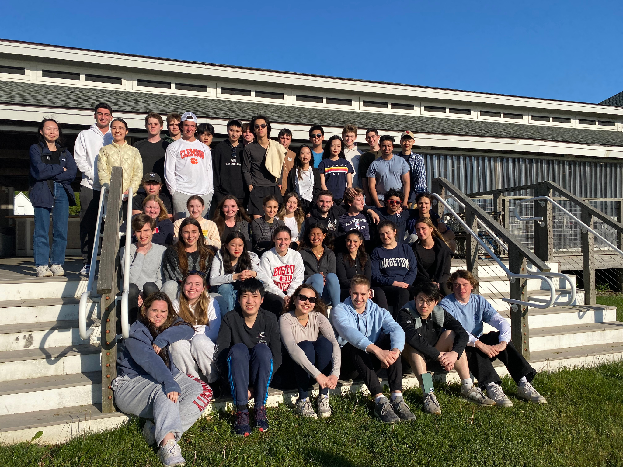 undergrad honors students pose on the steps of a visitor center in a rural area.