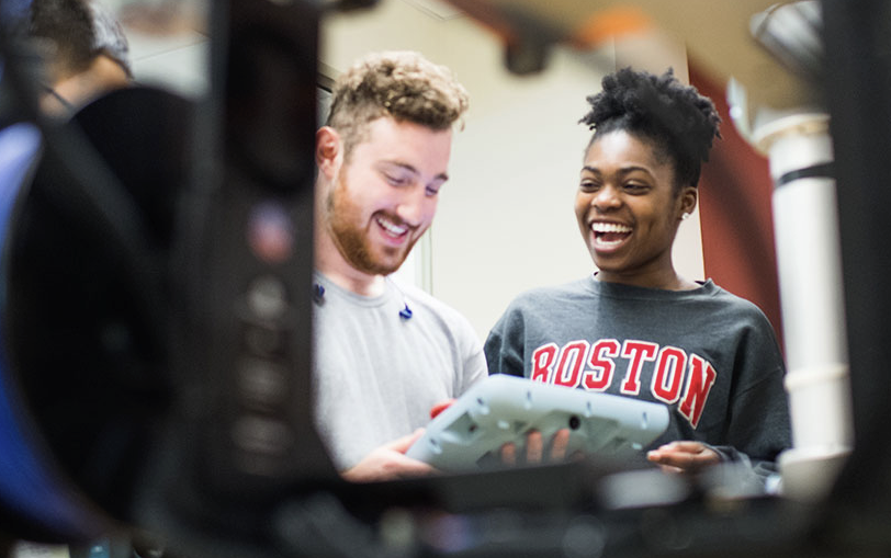 Two students laughing