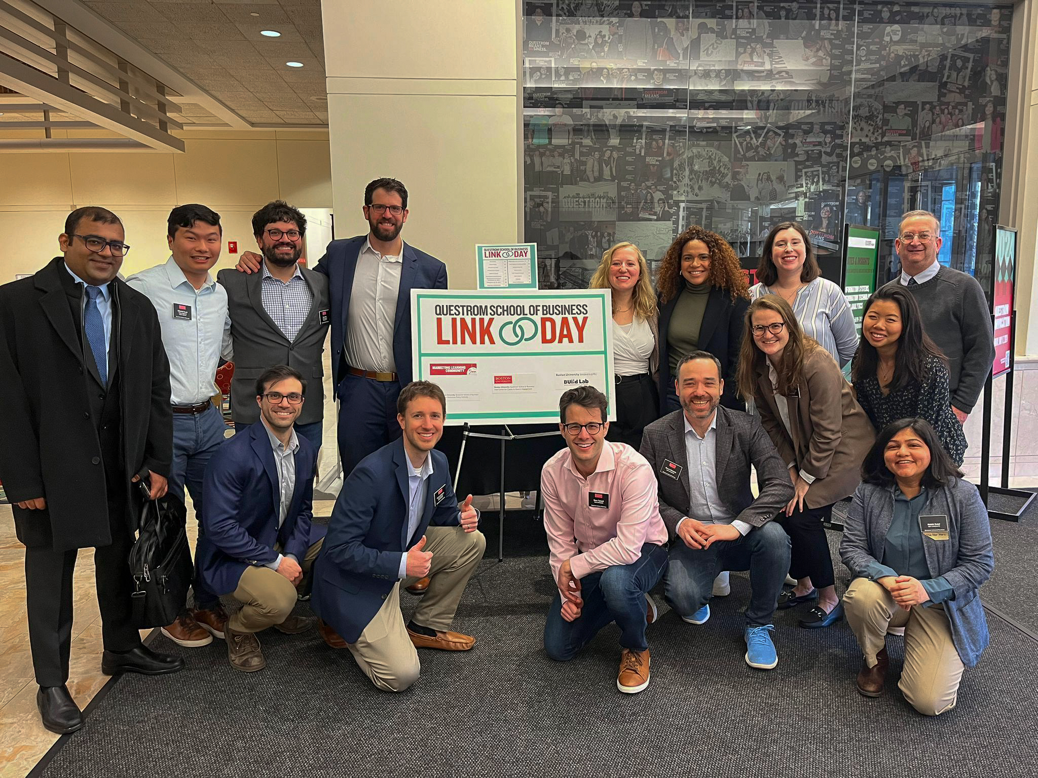 About 15 Social Impact Club students pose