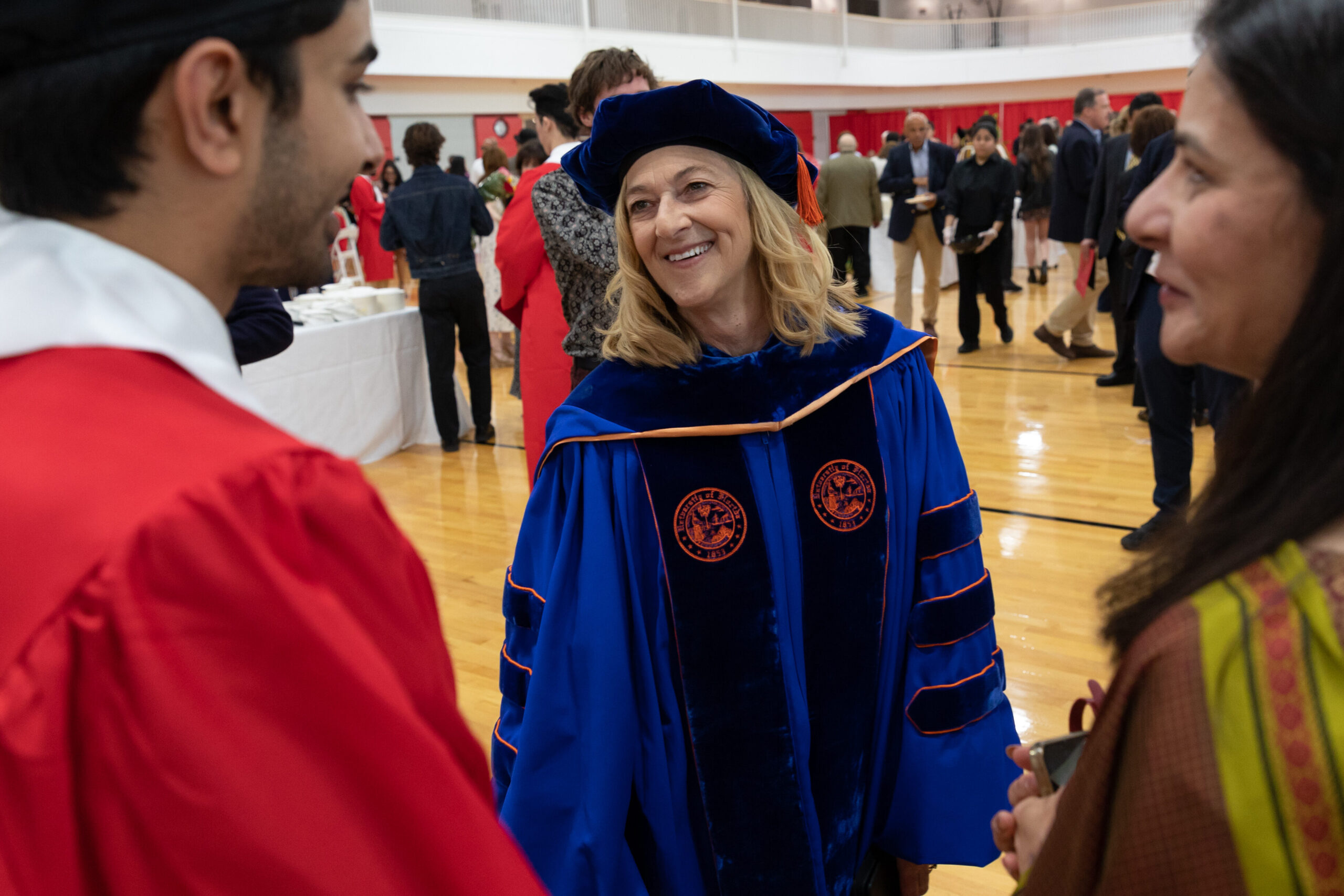 Dean Fournier speaking with students at Graduation