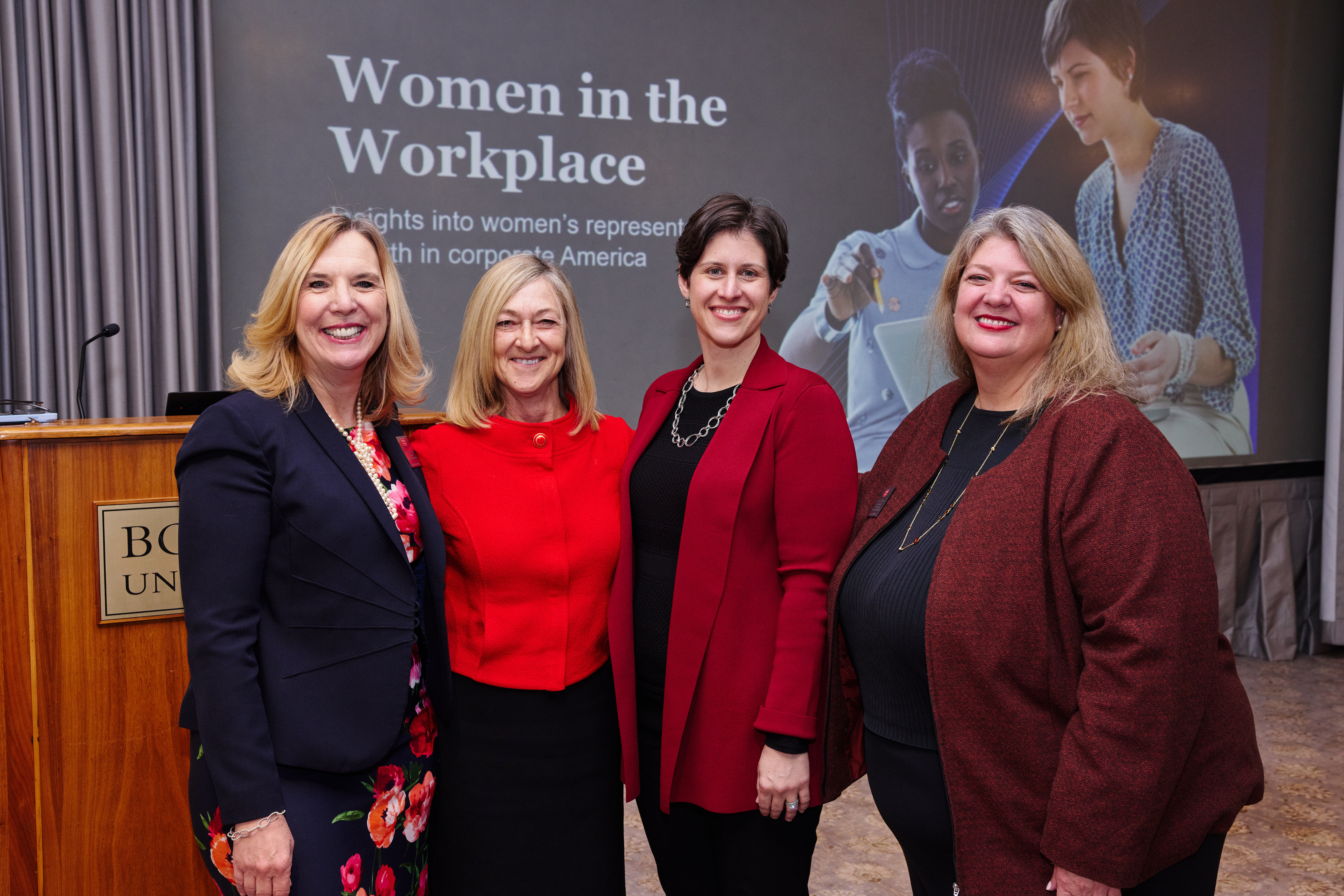 Dean Fournier posing with staff and faculty at a Women in the Workplace event