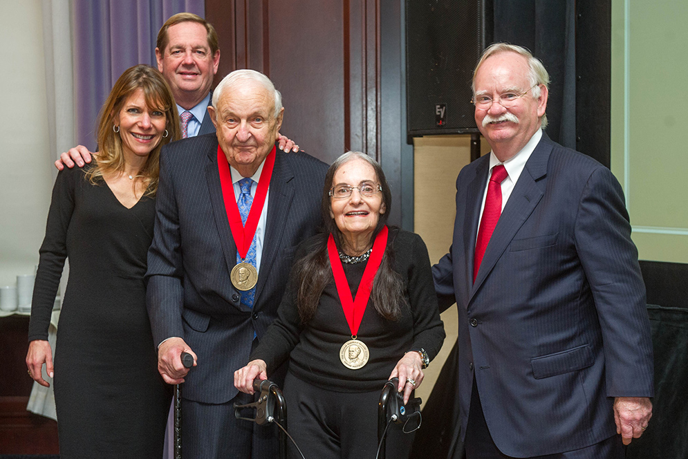 Smartly dressed donors pose together