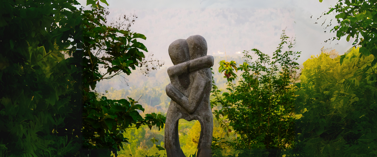 Stone sculpture of two people embracing