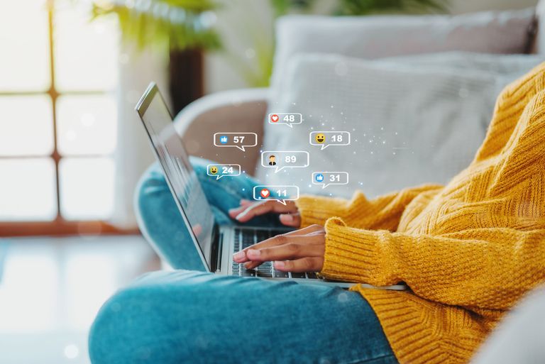 Person using social media on a laptop