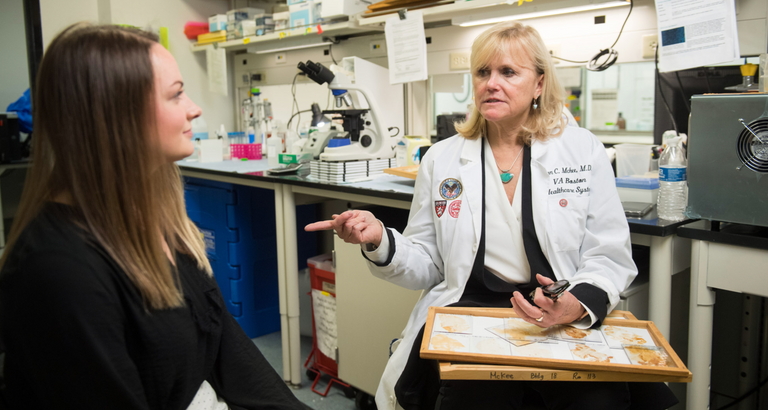 Journalist interviewing neuroscientist