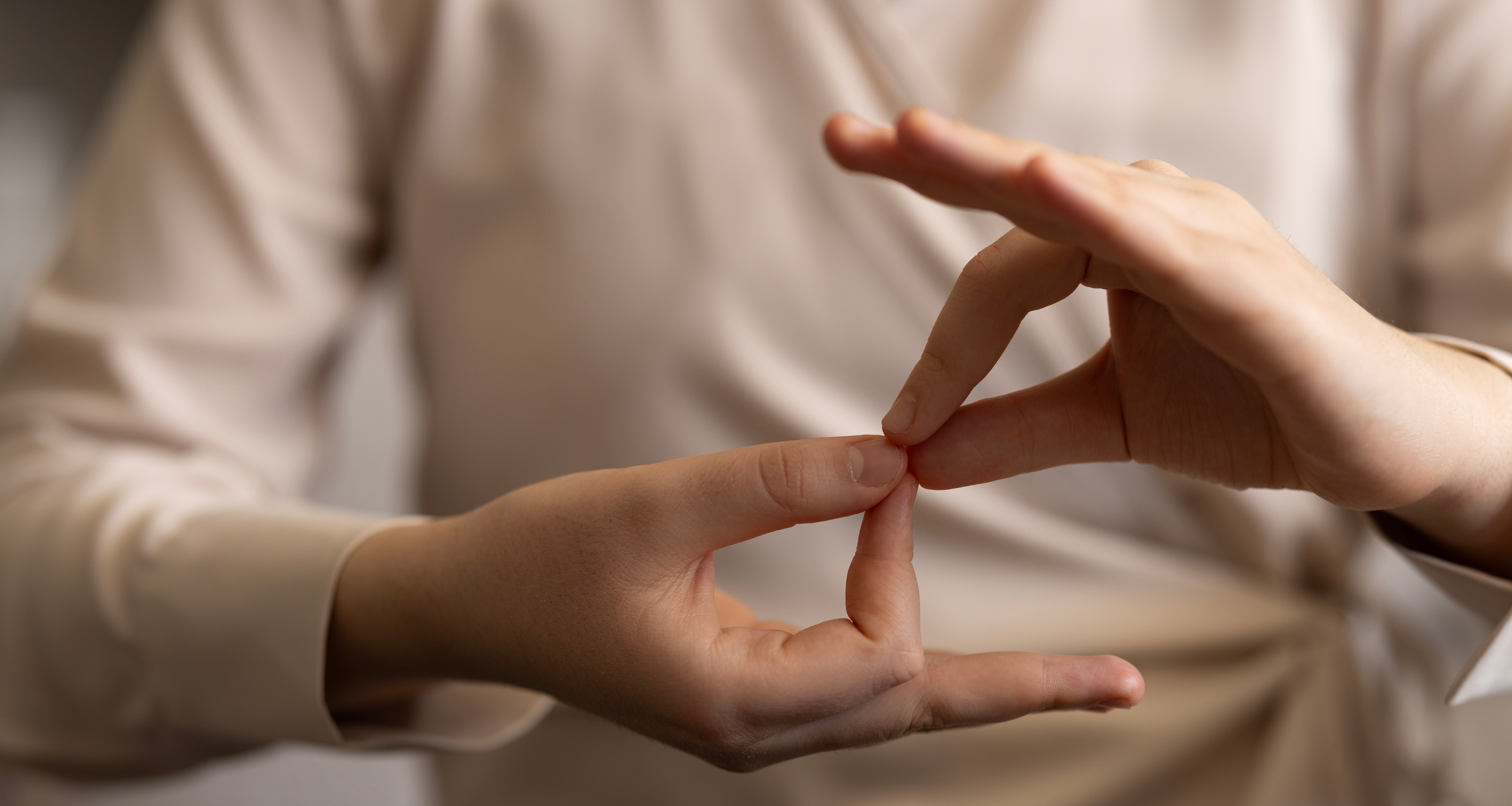 Close-up of hands using American sign language