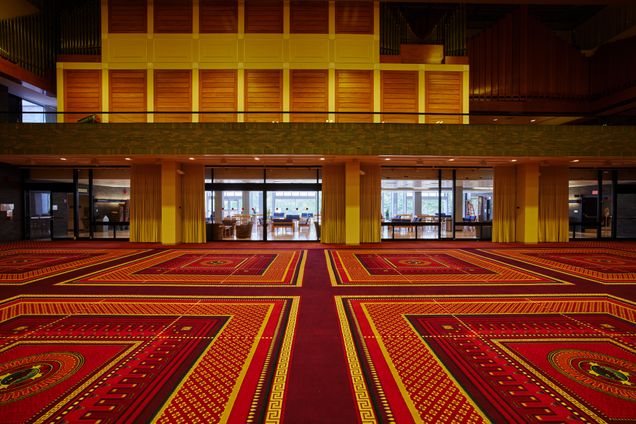 Empty view of ballroom looking towards glass wall into Ziskind Lounge & exterior windows. Silber Organ (with shutters closed) is overhead on the 2nd floor.