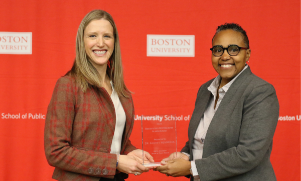 Scarlett Bellamy presents Audrey Hendricks with the 2024 Biostatistics Distinguished Alumni Award