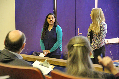 Rupal Shah, left, and Sarah Stevens answer questions from judges James Wolff, professor of global health, and Gail Steketee, dean of the School of Social Work.