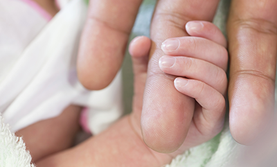 newborn-holding-parent-finger