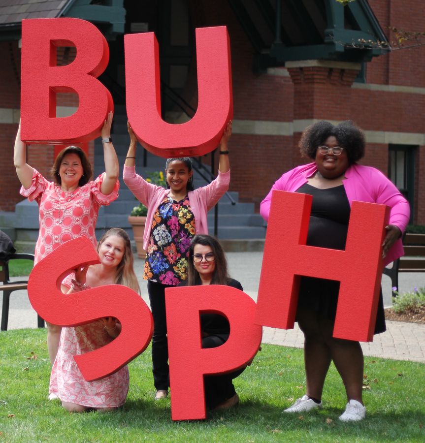The GSL team holding up large letters that spell out BUSPH