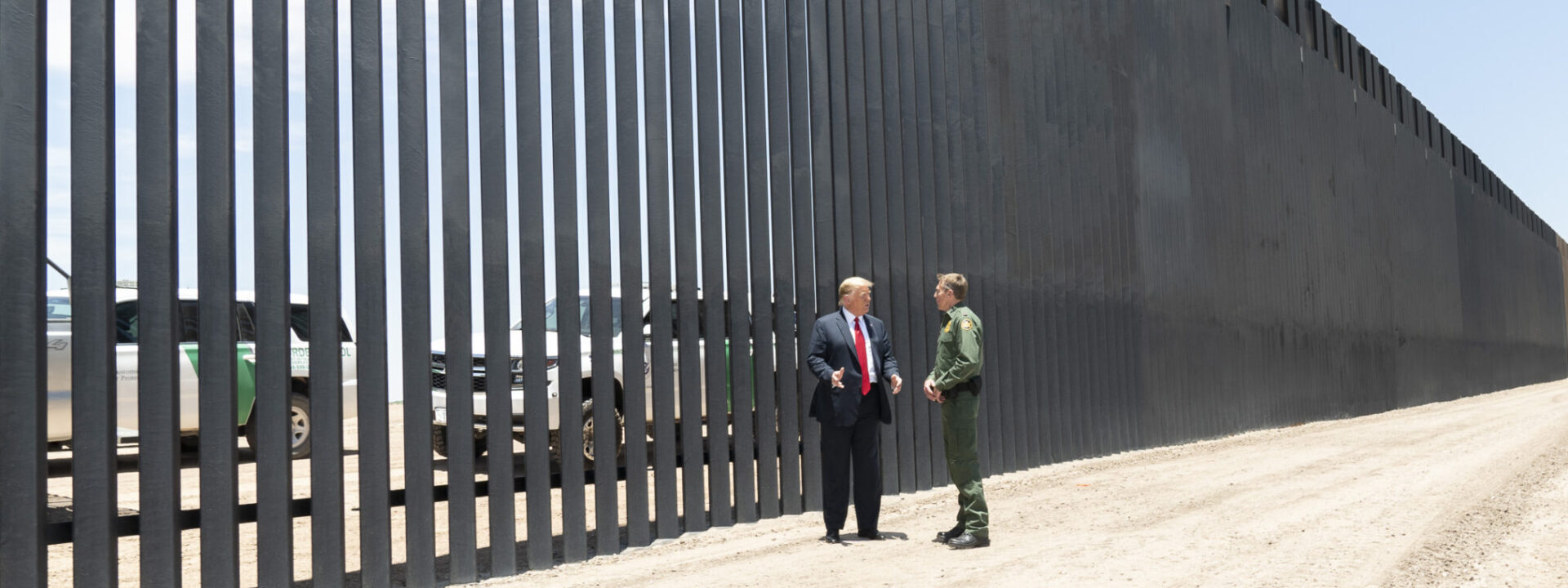 Trump stands beside the border wall with Mexico