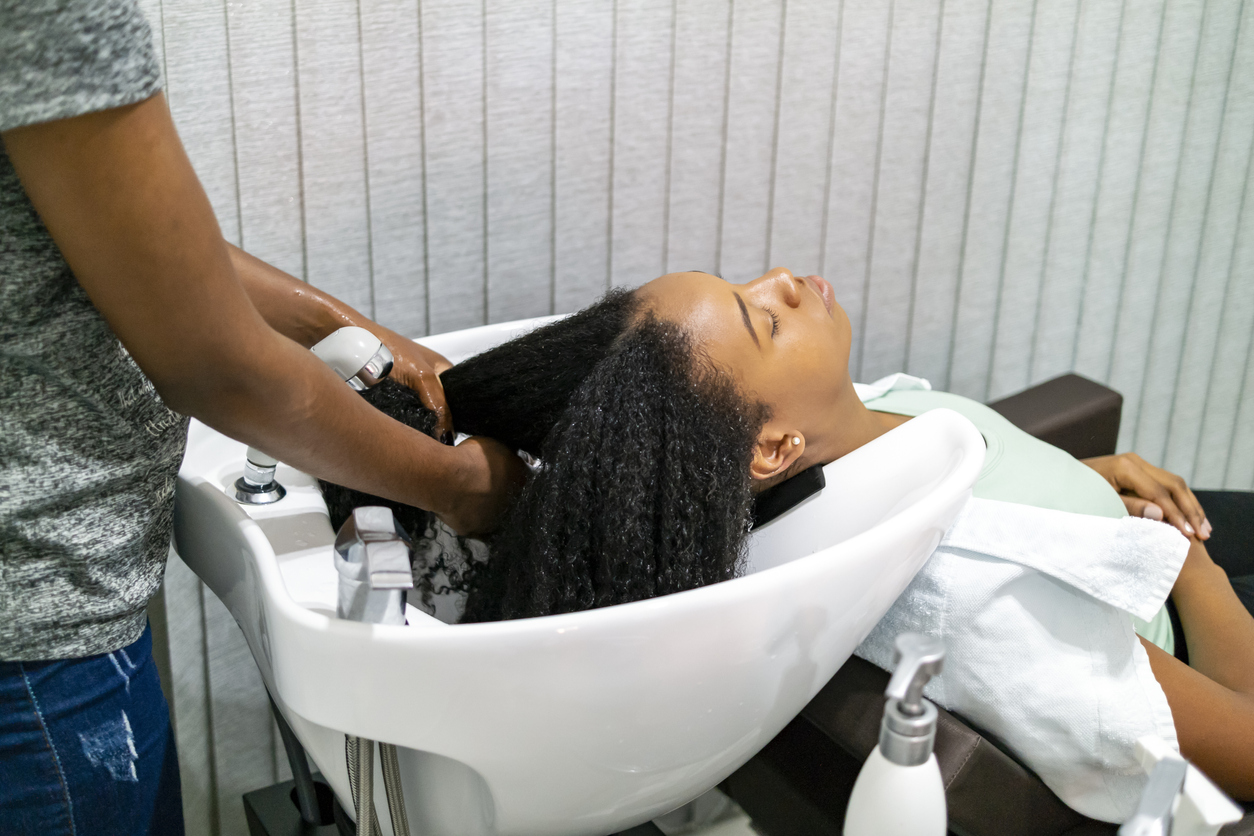Photo of two brazilian woman. A client and a hair stylist.