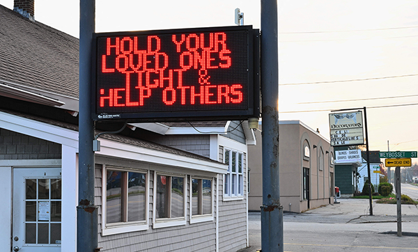 Lewiston ME shooting sign reading hold your loved ones close