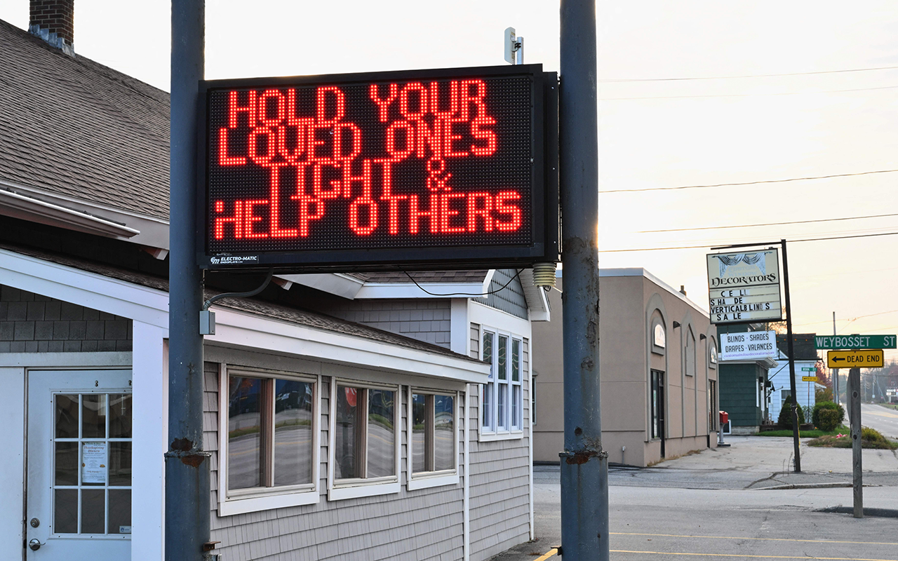 Lewiston ME shooting sign reading hold your loved ones close