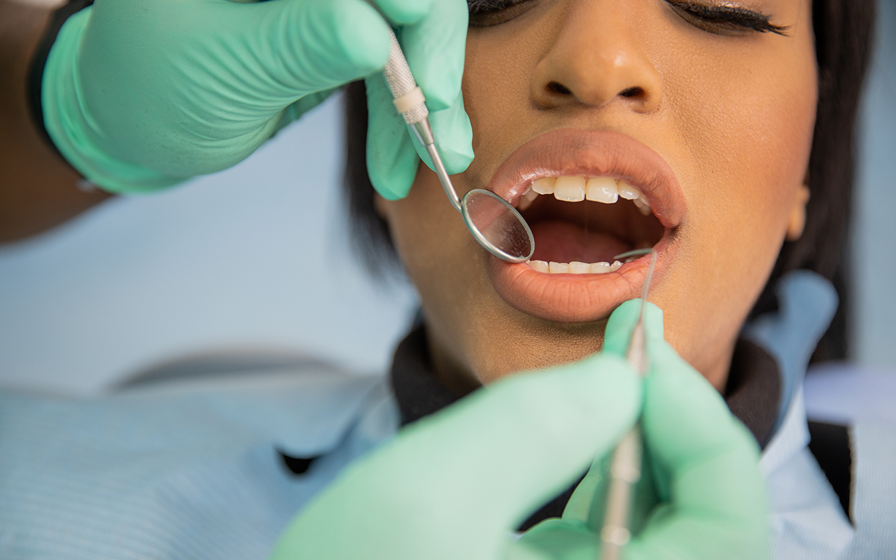 Black woman received dental exam