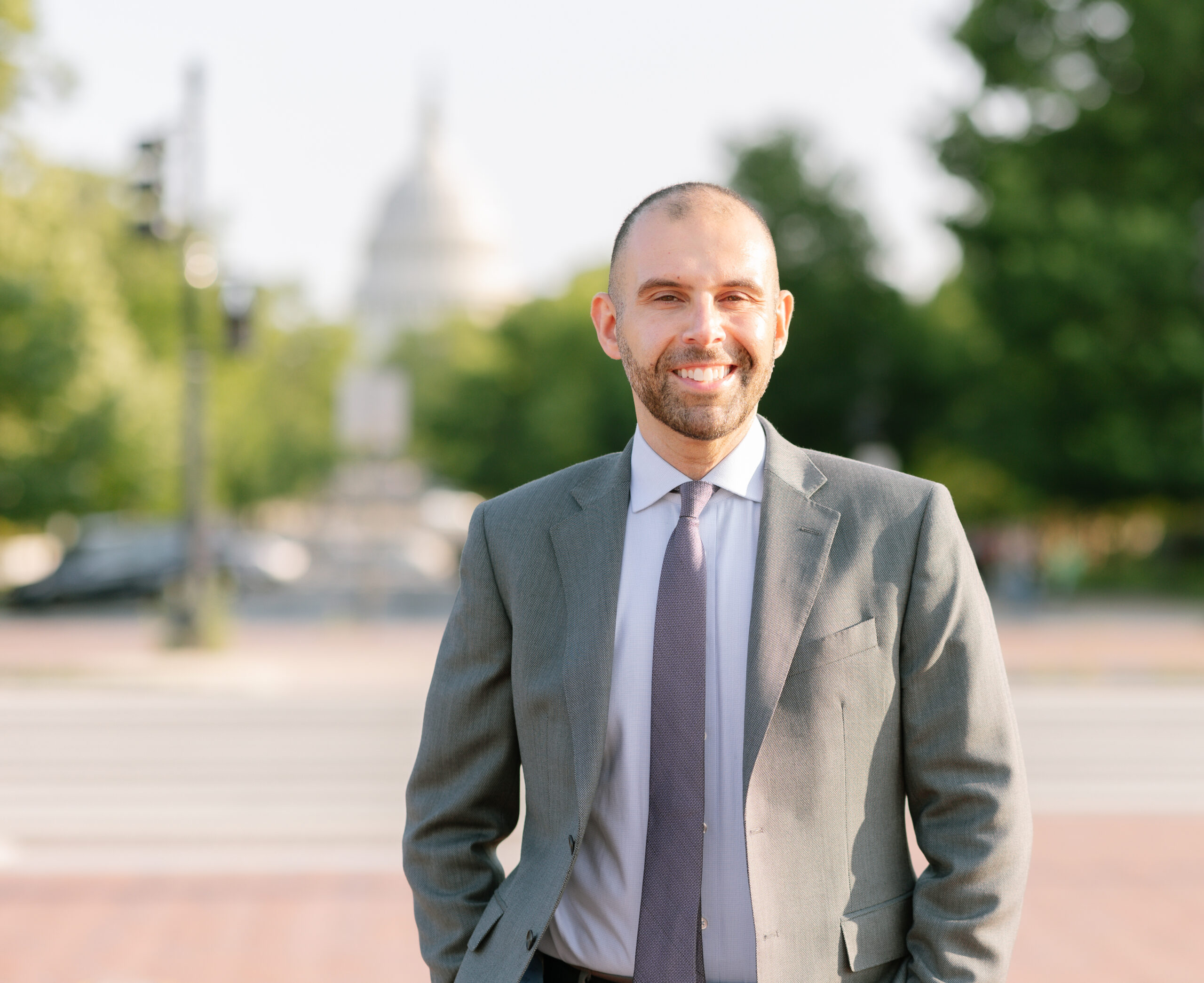 Headshot of Jirair Ratevosian in front of the Capital Building
