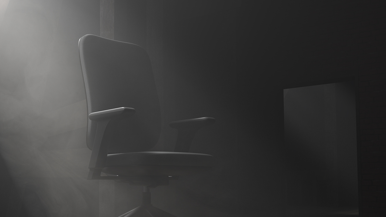 Black office chair in the shadows