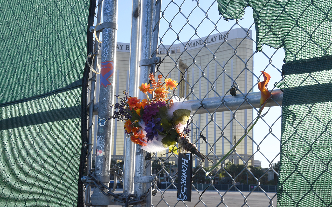 Bouquet of flowers hangs on a chainlink fence in Las Vegas, NV
