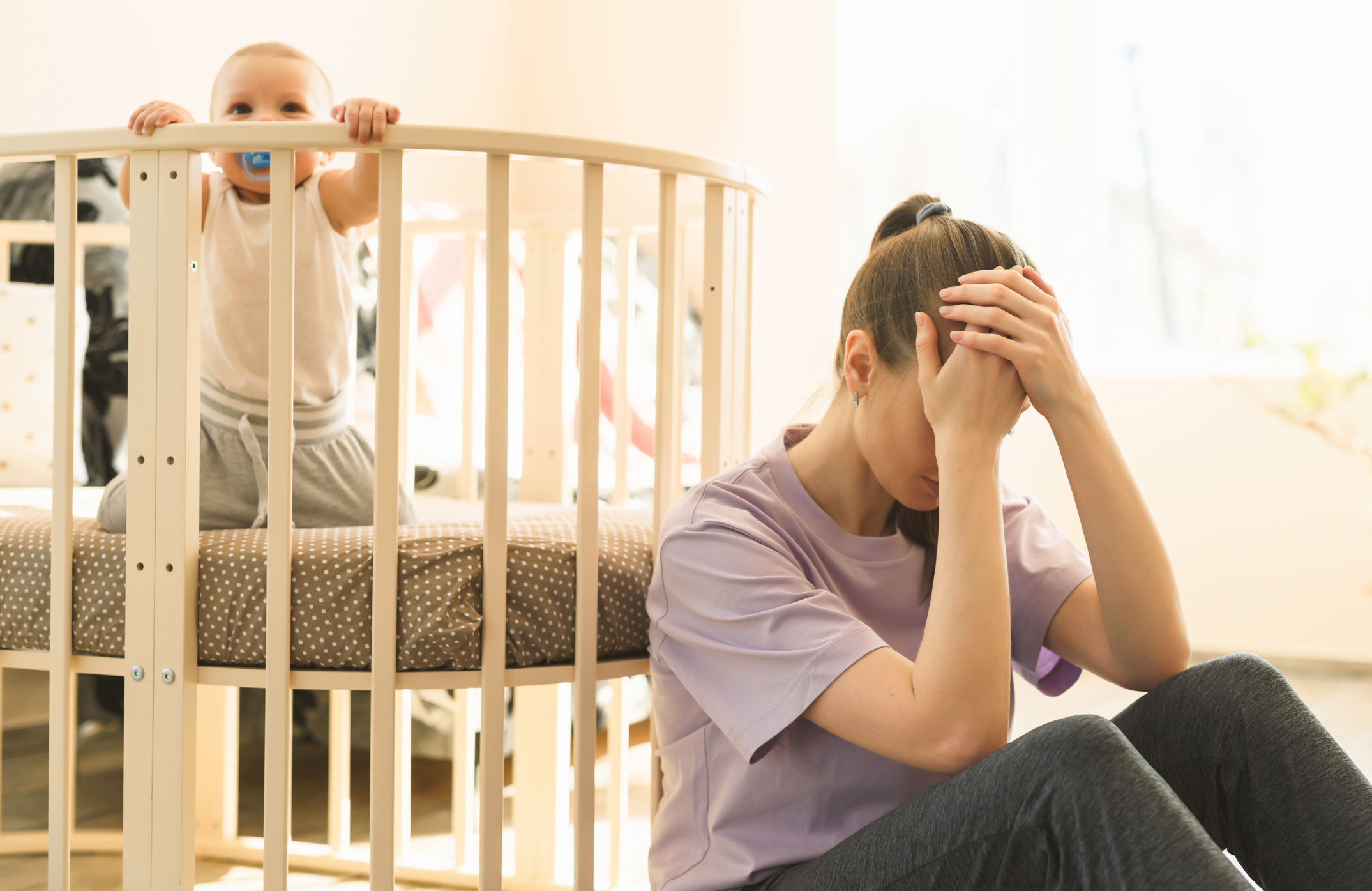 The mother is very tired, and the child does not want to fall asleep. The difficulties of motherhood, sleepless nights.