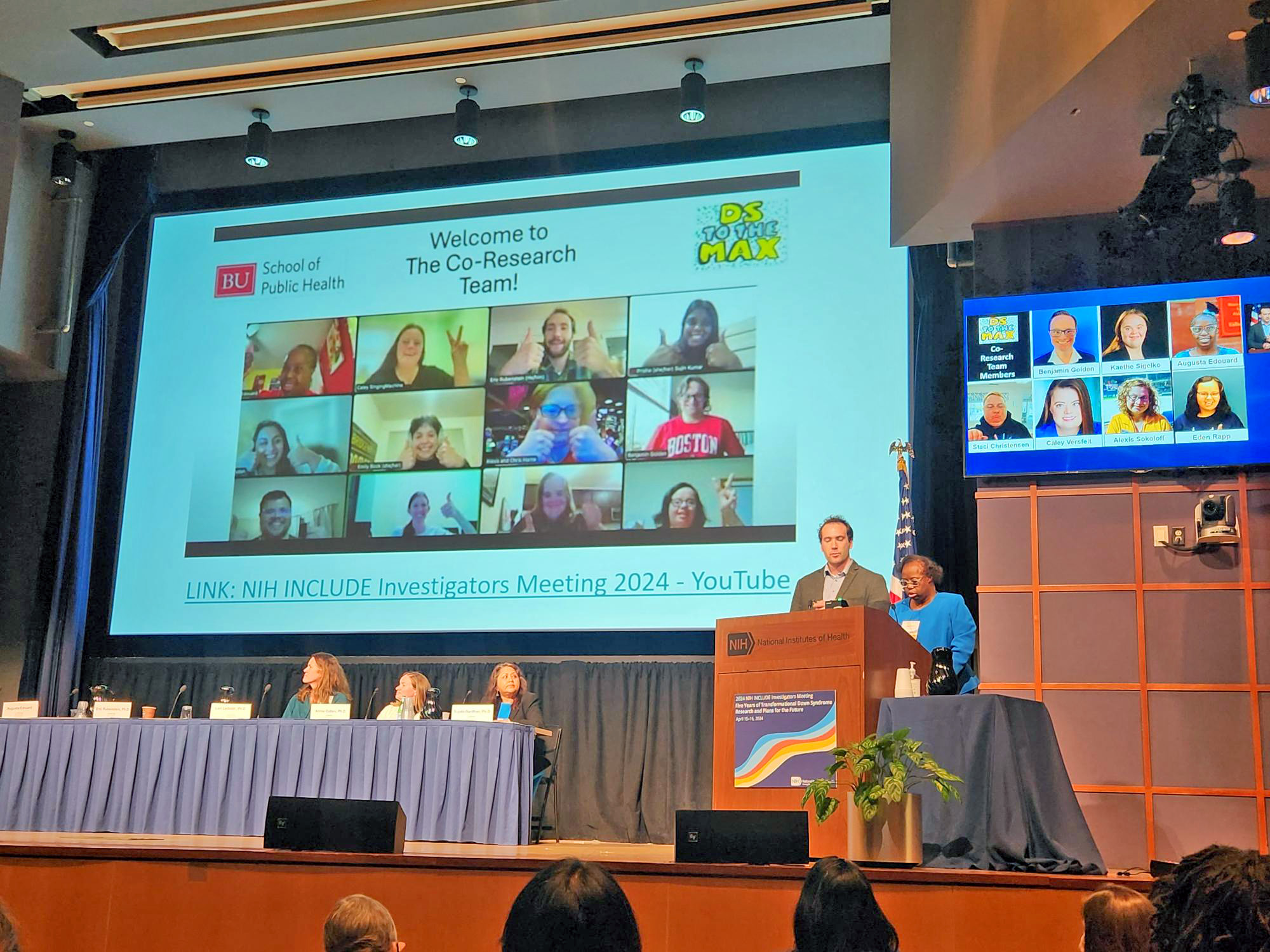 Eric Rubenstein and Gus Edouard present about their co-research team at a conference.