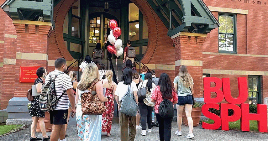 welcoming-student-at-orientation-into-the-Talbot-Building-BUSPH