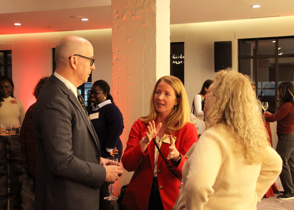 Michael Stein talking with colleagues at the Alumni and Friends Reception at APHA
