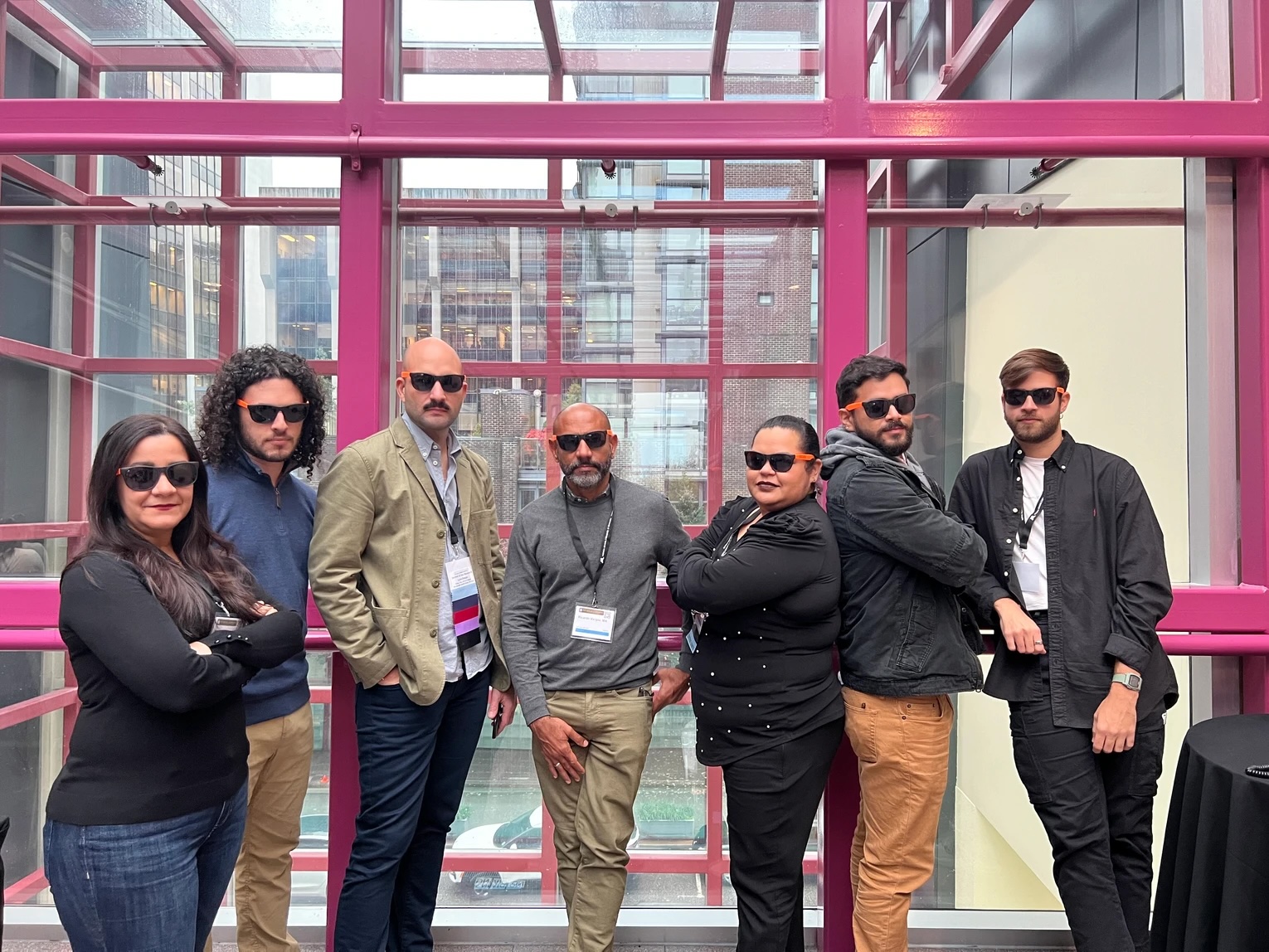 Members of the newly expanded research collaborative elTEAMnetwork stand side-by-side all wearing sunglasses