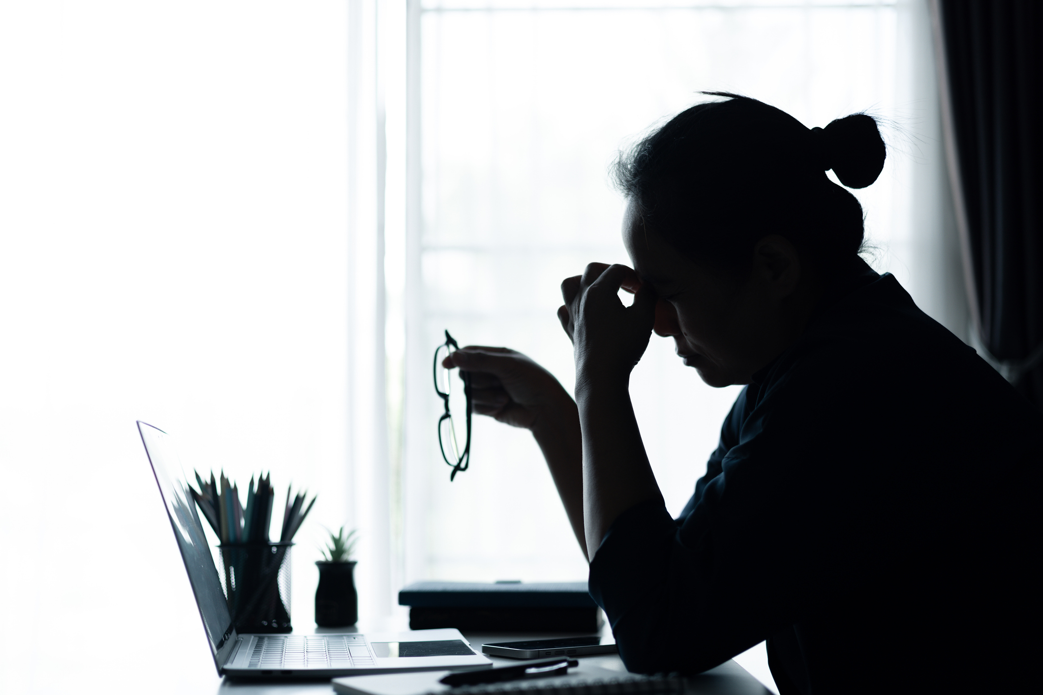 Businesswoman faced challenging problem at office, navigating work stress and using her computer to find solutions amidst feelings of depression. problem, woman, job, business, stress, depression.