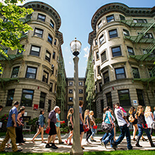  people walking in front of the BU School of Social Work building 