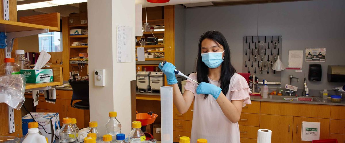 Boston University RISE Internship Track student in a lab