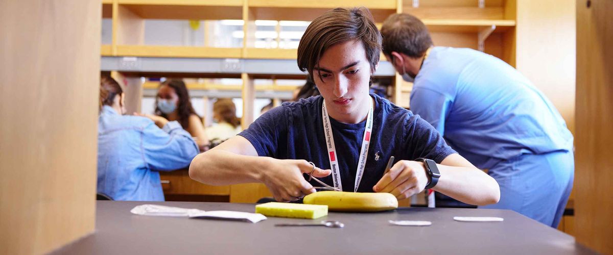 A Boston University student works on an experiment.