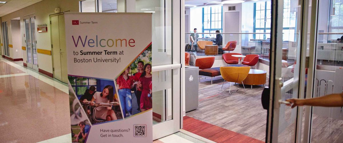 A Boston University Summer Term Welcome poster indoors - Course Codes & Numbers