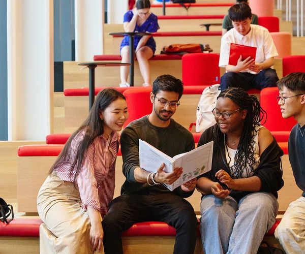 Students go over materials after class