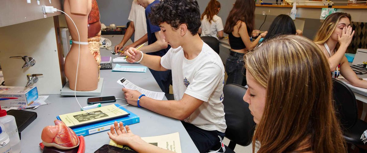 BU Summer Term students working on a biology assignment in a lab environment
