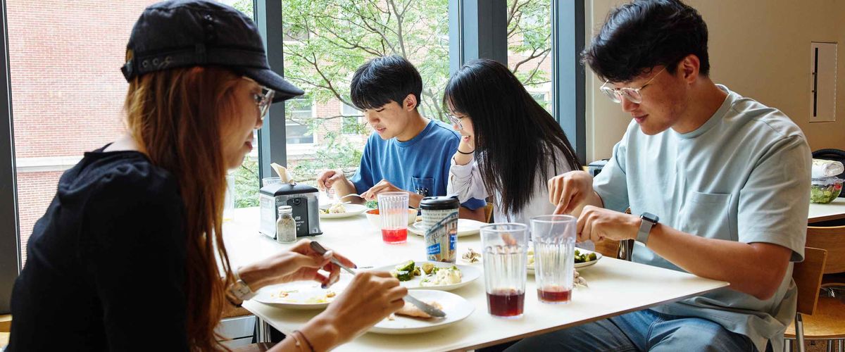 BU Summer Term students enjoying a meal together in a dining hall