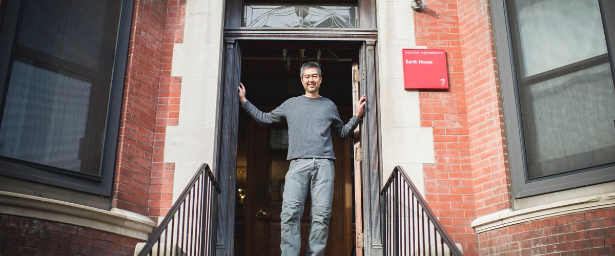Nathan Phillips poses for a photo in front of the Earth House on Friday, January 15, 2016. It is a residential education program at 7 Buswell St., where accepted environmental studies students will live and study the house itself, among other things, as part of a two year program of seminars and "experiential projects."