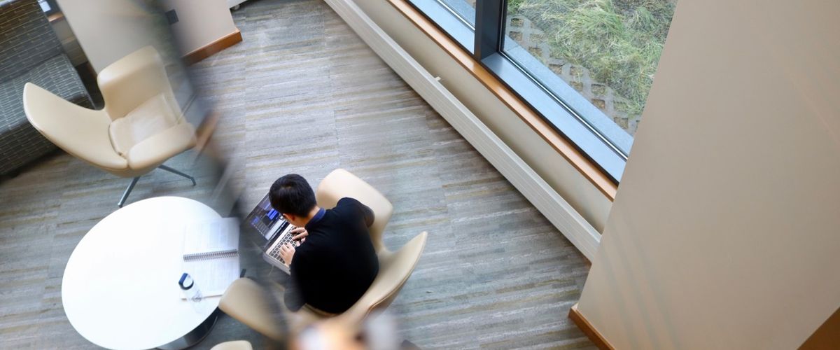 100 Bay State Road third floor study area with a person working on a computer