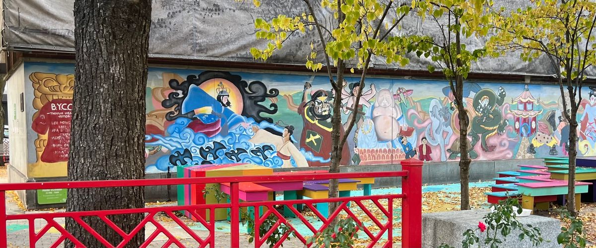 Chinatown street scene in Boston with mural and plants