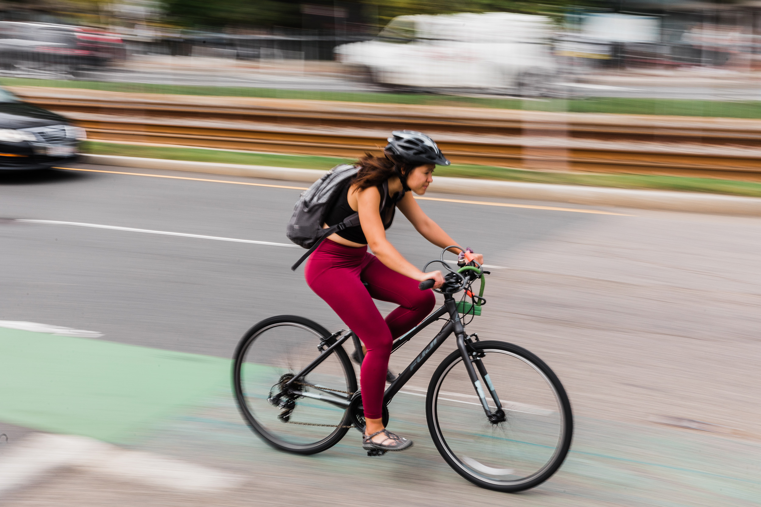 Cyclist on Commonwealth Ave with cars