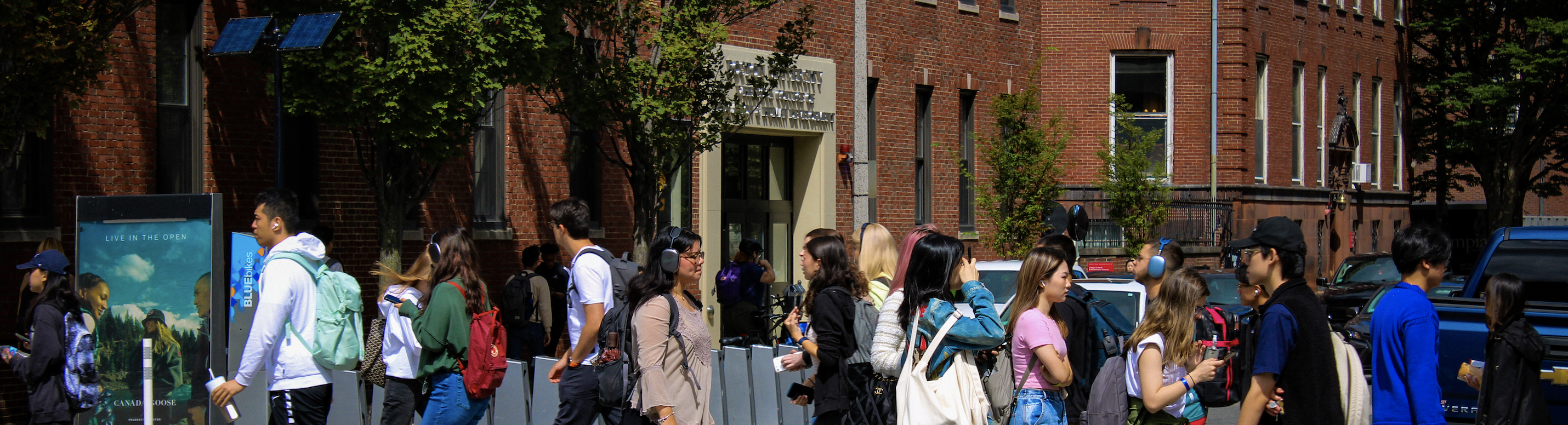 Students walking in crosswalk infront of BU Wheelock