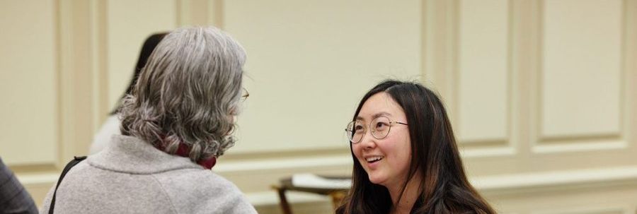 Eleonora Villegas-Reimers talking to student
