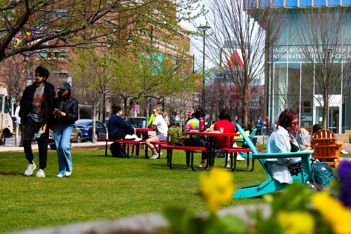 Students working on sunny day underneath the citgo sign