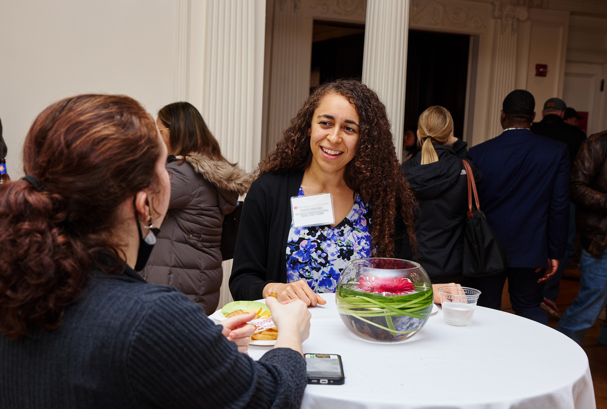Student talking with fellow prospective students at accepted students day