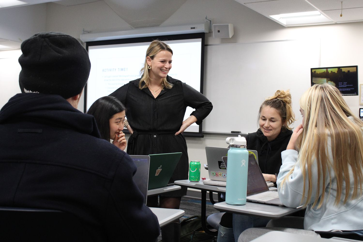 Carly Block speaks with students in her class about their end of semester reflections