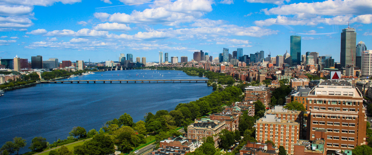 Skyline of Boston on the right with the charles river on the left